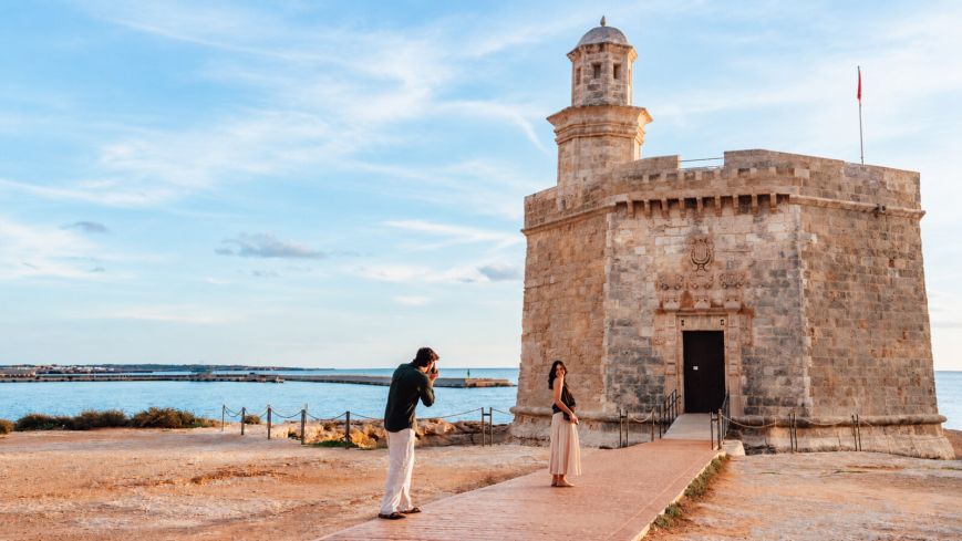 Castell de Sant Nicolau in Ciutadella de Menorca, with two people in the foreground